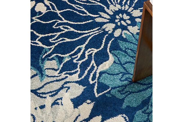 Bold is beautiful in this lush, modern floral design from the passion collection. Its oversize, imaginative blooms practically burst the serged-edges of this area rug. A rich and seductive look in magnificent blues and ivory, enhanced with cut pile for superb dimension and texture.Easy-care fibers | Excellent value | Medium pile | Machine made | Power-loomed | Low shedding | Recommended for areas with moderate foot traffic | Indoor only | 100% polypropylene | Imported