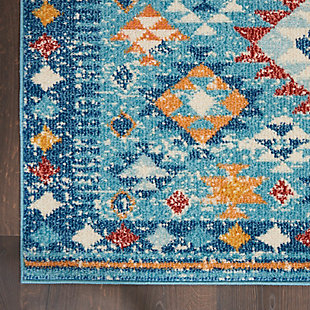 Diamonds dazzle in this Passion Collection area rug featuring a delightfully intricate, tribal-inspired design and a colorful mix of blue, orange and red multicolor. A modern rug with traditional appeal, it brings a fresh southwestern spirit into your living room, family room, dining room, home office or bedroom. Power-loomed of soft polypropylene, this rug feels comfortably thick and is kid and pet friendly.Easy-care fibers | Serged edges | Cut pile | Machine made | Power-loomed | Low shedding | Recommended for areas with moderate foot traffic | Indoor only | 100% Polypropylene | Imported