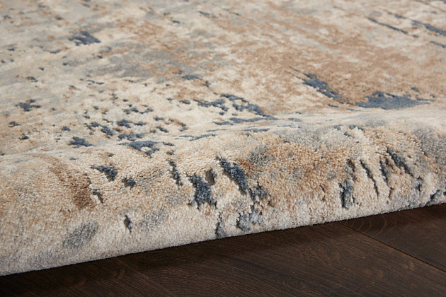 Abstract design creates an irresistibly textural surface in this sophisticated quarry area rug. Cool shades of slate grey and sandy beige mingle with alabaster in a beautifully natural palette that mimics the effect of natural stone. Soft, sensual and ideal for rooms ranging from traditional to contemporary.Easy-care fibers | Serged edges | Cut pile | Machine made | Power-loomed | Moderate shedding | Recommended for areas with moderate foot traffic | Indoor only | 80% polypropylene, 20% polyester | Imported