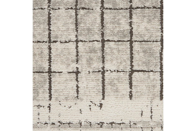 A subtle grid creates a linear motif in this modern abstract area rug from the quarry collection. Its contemporary allure is finished with a side borders, an intriguingly distressed surface and a thick, luscious pile with cut texture. Power-loomed in soft ivory, quartz grey, and taupe detailing with serged edge for modern simplicity.Easy-care fibers | Serged edges | Cut pile | Machine made | Power-loomed | Moderate shedding | Recommended for areas with moderate foot traffic | Indoor only | 80% polypropylene, 20% polyester | Imported