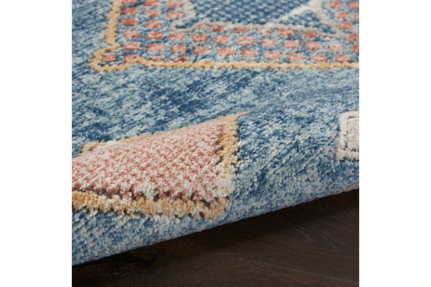 A bold trio of diamonds centers this exciting, moroccan-inspired area rug from the quarry collection. Elegant and versatile in a stunning mineral palette of lapis blue with details in orange, gold and ivory, this power-loomed rug delivers texture and comfort with its thick cut-pile and soft, easy to clean blend of polyester and polypropylene. A vintage fade, ornamental border and serged edge complement boho, contemporary, and modern styles of decor.Easy-care fibers | Serged edges | Cut pile | Machine made | Power-loomed | Moderate shedding | Recommended for areas with moderate foot traffic | Indoor only | 80% polypropylene, 20% polyester | Imported
