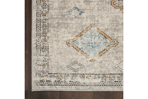 Decorate with diamonds! This unique, moroccan-inspired center medallion design from the quarry collection of area rugs presents a string of diamonds in a subtle mineral palette of ivory, blue, and gold. Power-loomed for texture and comfort with thick cut-pile in a soft, easy to clean blend of polyester and polypropylene. A vintage fade, ornamental border and serged edge complement boho, contemporary, and modern styles of decor.Easy-care fibers | Serged edges | Cut pile | Machine made | Power-loomed | Moderate shedding | Recommended for areas with moderate foot traffic | Indoor only | 80% polypropylene, 20% polyester | Imported