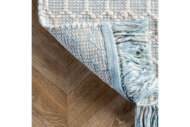 Made from the finest materials in the world and with the uttermost care, our rugs are a great addition to your home.Handmade | Imported | Material: 84% wool, 16% cotton | Bac: no bac | Setting: indoor | Recommended rooms: bedroom, living room | Includes fringe