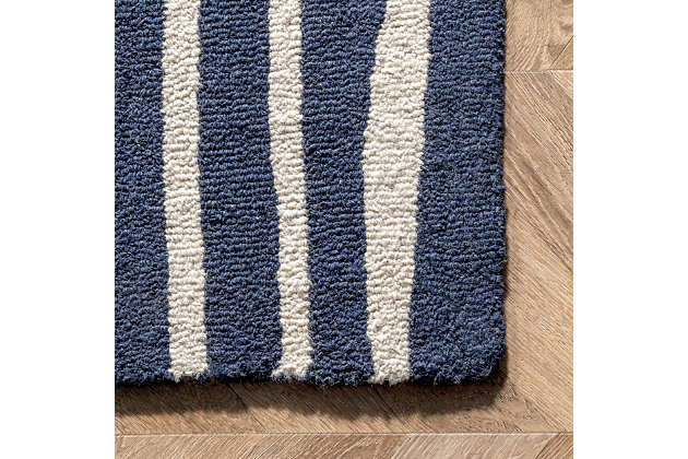 Made from the finest materials in the world and with the uttermost care, our rugs are a great addition to your home.Hand tufted | Imported | Material: 100% wool | Backing: non-slip latex | Setting: indoor | Recommended rooms: living room, bedroom