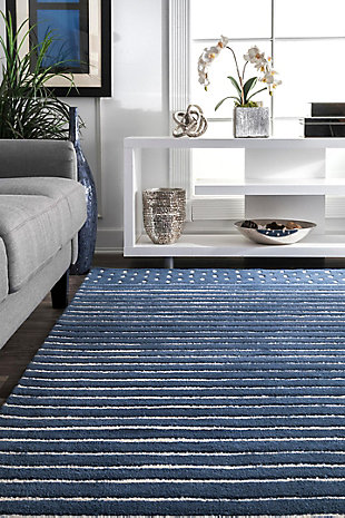 Made from the finest materials in the world and with the uttermost care, our rugs are a great addition to your home.Hand loomed | Imported | Material: 100% wool | Backing: canvas | Setting: indoor | Recommended rooms: bedroom, living room