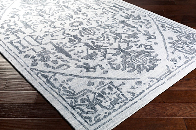 The Hightower Accent Rug showcases a timeless style of elegance, comfort and sophistication. This hand-knotted rug has a durability that can't be found in other handmade constructions. It can also be thoroughly cleaned, because it contains no chemicals that react to water (such as glue). Made with viscose, this rug has a medium pile. Made of viscose | Hand-knotted | 1-year limited warranty | Imported