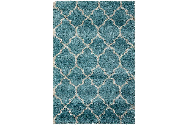 With its vintage pattern and engaging hues, this terrific accent rug exudes a hip, retro vibe that's sure to add an easy shot of style to any space. Warm, inviting and irresistibly textured for the ultimate in cozy comfort.Made of polypropylene and jute | Machine made | Power-loomed | Shag pile (more than 1" high) | Serged edges | Vacuum regularly; clean spills immediately by blotting with a clean damp sponge or cloth; professional cleaning recommended | Rug pad recommended | Recommended for areas with moderate foot traffic | Low shedding | Imported