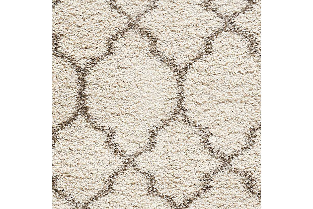 With its vintage pattern and rich hues, this marvelous rug exudes a retro vibe sure to add a shot of style to any space. Warm, inviting, and irresistably textured, it's the ultimate in cozy comfort.Serged edges, easy-care fibers | Shag pile | Machine made | Serged edges | Low shedding | Recommended for areas with moderate foot traffic | Rectangle | Indoor only