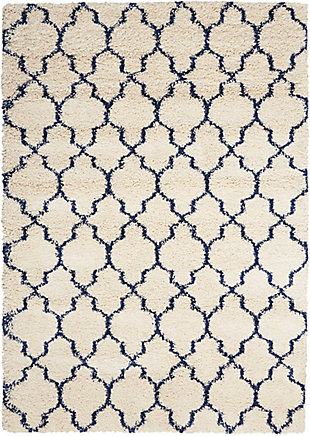 With its vintage pattern and rich hues, this wonderful rug exudes a retro vibe sure to add a shot of style to any space. Warm, inviting, and irresistably textured, it's the ultimate in cozy comfort.Made of jute | Machine made | Power-loomed | Shag pile (more than 1" high) | Serged edges | Vacuum regularly; clean spills immediately by blotting with a clean damp sponge or cloth; professional cleaning recommended | Rug pad recommended | Recommended for areas with moderate foot traffic | Low shedding | Imported