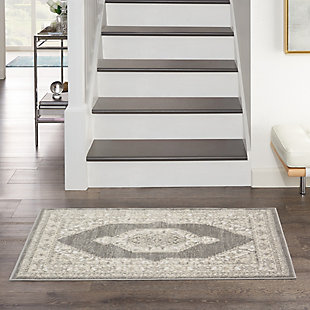Decorate with classic assurance with the formal beauty of this accent rug. It hits all the notes of traditional persian design, from the strong center medallion to the intricate floral surround and decorative border, while a contemporary sense of color and easy-care fibers lend the best of modern style.Made of polypropylene and polyester | Machine made | Thin pile (less than 0.5" high) | Power-loomed | Vacuum regularly (no beater bar) | Low shedding | Rug pad recommended | Recommended for areas with moderate foot traffic | Imported
