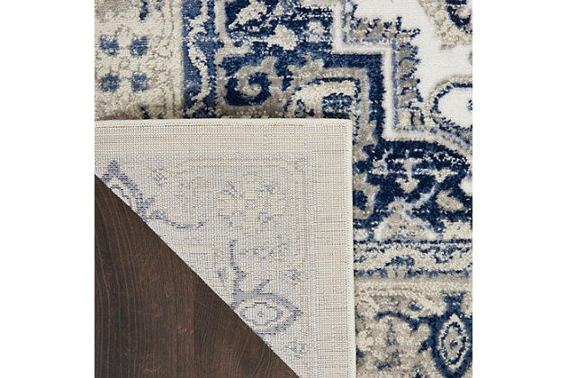 This subtly dramatic runner is the perfect focal point for any space in need of sophisticated elegance. An elaborate center medallion layers floral and geometric motifs together for an endlessly fascinating design. Easy-care non-shed fibers promise modern convenience and delicious softness.Made of polypropylene and polyester | Machine made | Thin pile (less than 0.5" high) | Power-loomed | Vacuum regularly (no beater bar) | Low shedding | Rug pad recommended | Recommended for areas with moderate foot traffic | Imported