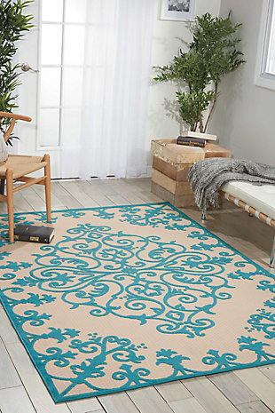 A pretty and playful pattern of scrolling vines really turns on the charm when presented in alluring aqua blue and ivory. This high-low textured indoor/outdoor rug will bring fresh and fabulous flair to your patio, porch, or deck. Machine made of polypropylene for easy cleaning (simply hose-rinse and air dry).Serged edges | Easy-care fibers | Combination weave | Machine made | Power-loomed | Low shedding | Recommended for areas with heavy foot traffic | Indoor/outdoor | Adding a layer of padding helps cushion the rug and diminish pressure, helping to prolong the rug's life; also, the extra padding helps reduce sound in the room | Rug pad recommended | Vacuum regularly, clean spills immediately by blotting with a clean damp sponge or cloth; rinse with a hose if cleaning it outdoors; to extend the life of this area rug, bring it indoors during extreme weather | 100% polypropylene | Imported