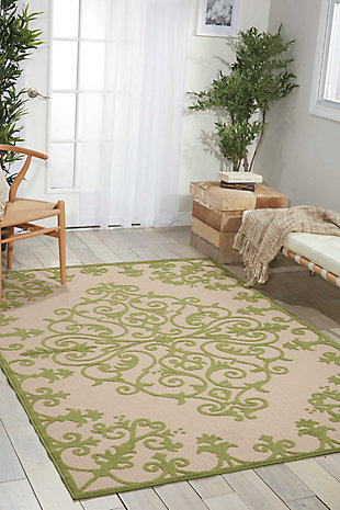 A pretty and playful pattern of scrolling vines really turns on the charm when presented in alluring green and beige. This high-low textured indoor/outdoor rug will bring fresh and fabulous flair to your patio, porch, or deck. Machine made of polypropylene for easy cleaning (simply hose-rinse and air dry).Serged edges | Easy-care fibers | Combination weave | Machine made | Power-loomed | Low shedding | Recommended for areas with heavy foot traffic | Indoor/outdoor | Adding a layer of padding helps cushion the rug and diminish pressure, helping to prolong the rug's life; also, the extra padding helps reduce sound in the room | Rug pad recommended | Vacuum regularly, clean spills immediately by blotting with a clean damp sponge or cloth; rinse with a hose if cleaning it outdoors; to extend the life of this area rug, bring it indoors during extreme weather | 100% polypropylene | Imported