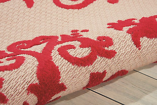 A pretty and playful pattern of scrolling vines really turns on the charm when presented in bright red and beige. This high-low textured indoor/outdoor rug will bring fresh and fabulous flair to your patio, porch, or deck. Machine made of polypropylene for easy cleaning (simply hose-rinse and air dry).Serged edges | Easy-care fibers | Combination weave | Machine made | Power-loomed | Low shedding | Recommended for areas with heavy foot traffic | Indoor/outdoor | Adding a layer of padding helps cushion the rug and diminish pressure, helping to prolong the rug's life; also, the extra padding helps reduce sound in the room | Rug pad recommended | Vacuum regularly, clean spills immediately by blotting with a clean damp sponge or cloth; rinse with a hose if cleaning it outdoors; to extend the life of this area rug, bring it indoors during extreme weather | 100% polypropylene | Imported