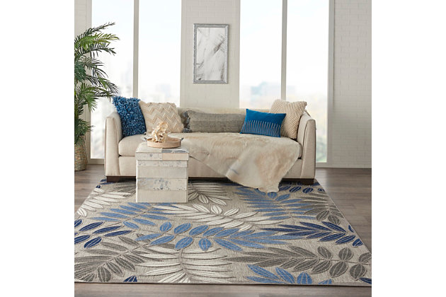 A cheerful and charming oversized leaf design is a fun, flirty and fashionable way to uplift any environment, especially when presented in complementary hues of blue, turquoise, cream and gray. This aloha indoor/outdoor area rug from nourison is created from premium stain-resistant fibers for long wear, low maintenance, and a splendid texture.Hand carved | Long wear, low maintenance and splendid texture | Flat weave | Machine made from premium stain-resistant fibers | Power-loomed | Low shedding | Recommended for areas with heavy foot traffic | Indoor/outdoor | Adding a layer of padding helps cushion the rug and diminish pressure, helping to prolong the rug's life; also, the extra padding helps reduce sound in the room | Rug pad recommended | Vacuum regularly, clean spills immediately by blotting with a clean damp sponge or cloth; rinse with a hose if cleaning it outdoors; to extend the life of this area rug, bring it indoors during extreme weather | 100% polypropylene | Imported
