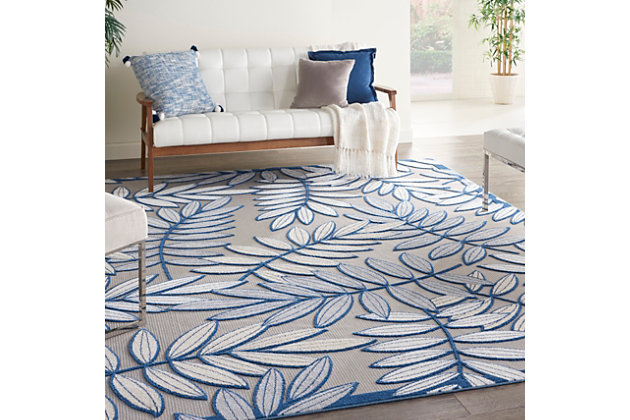 A cheerful and charming oversized leaf design is a fun, flirty, and fashionable way to uplift any environment, especially when presented in complementary hues of gray, navy, and ivory. This aloha indoor/outdoor area rug from nourison is created from premium stain-resistant fibers for long wear, low maintenance, and a splendid texture.Serged edges | Long wear, low maintenance and splendid texture | Combination weave | Machine made from premium stain-resistant fibers | Power-loomed | Low shedding | Recommended for areas with heavy foot traffic | Indoor/outdoor | Adding a layer of padding helps cushion the rug and diminish pressure, helping to prolong the rug's life; also, the extra padding helps reduce sound in the room | Rug pad recommended | Vacuum regularly, clean spills immediately by blotting with a clean damp sponge or cloth; rinse with a hose if cleaning it outdoors; to extend the life of this area rug, bring it indoors during extreme weather | 100% polypropylene | Imported