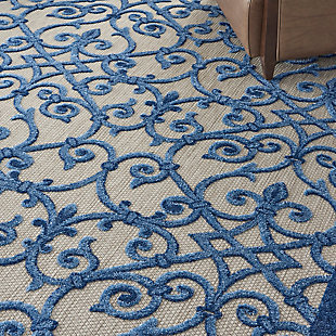 With its textural high-low style pile and scrolling floral design, this aloha indoor/outdoor rug invites a sophisticated feel to your home. Complementary tones of navy, light blue and beige make for an elegant centerpiece for your patio or deck. Created from premium stain-resistant fibers for easy cleaning and upkeep (just rinse with a hose and air dry).Hand carved | Premium stain-resistant fibers for easy cleaning | Flat weave | Machine made | Power-loomed | Low shedding | Recommended for areas with heavy foot traffic | Indoor/outdoor | Adding a layer of padding helps cushion the rug and diminish pressure, helping to prolong the rug's life; also, the extra padding helps reduce sound in the room | Rug pad recommended | Vacuum regularly, clean spills immediately by blotting with a clean damp sponge or cloth; rinse with a hose if cleaning it outdoors; to extend the life of this area rug, bring it indoors during extreme weather | 100% polypropylene | Imported
