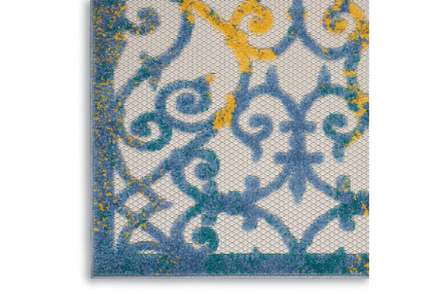 With its textural high-low style pile and scrolling floral design, this aloha indoor/outdoor rug invites a sophisticated feel to your home. Vibrant blue and golden yellow tones with hints of green, woven onto a ground of ivory makes for an elegant centerpiece for your patio or deck. Created from premium stain-resistant fibers for easy cleaning and upkeep (just rinse with a hose and air dry).Serged edges | Premium stain-resistant fibers for easy cleaning | Combination weave | Machine made from easy-care fibers | Power-loomed | Low shedding | Recommended for areas with heavy foot traffic | Indoor/outdoor | Adding a layer of padding helps cushion the rug and diminish pressure, helping to prolong the rug's life; also, the extra padding helps reduce sound in the room | Rug pad recommended | Vacuum regularly, clean spills immediately by blotting with a clean damp sponge or cloth; rinse with a hose if cleaning it outdoors; to extend the life of this area rug, bring it indoors during extreme weather | 100% polypropylene | Imported