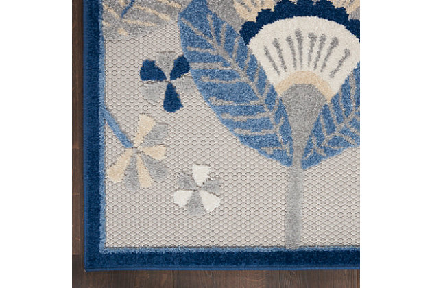 Uplift your surroundings in style with the fun, oversized florals of this indoor/outdoor rug from the aloha collection. A palette of cool blue, neutral ivory, gray, and white are framed by a navy border designed to bring bold definition to your porch, patio, or indoor decor. Expertly machine made of premium, stain resistant fibers, this aloha area rug offers durability and ease of cleaning (just rinse with a hose and air dry).Serged edges | Premium stain-resistant fibers for durability and easy cleaning | Combination weave | Machine made from easy-care fibers | Power-loomed | Low shedding | Recommended for areas with heavy foot traffic | Indoor/outdoor | Adding a layer of padding helps cushion the rug and diminish pressure, helping to prolong the rug's life; also, the extra padding helps reduce sound in the room | Rug pad recommended | Vacuum regularly, clean spills immediately by blotting with a clean damp sponge or cloth; rinse with a hose if cleaning it outdoors; to extend the life of this area rug, bring it indoors during extreme weather | 100% polypropylene | Imported