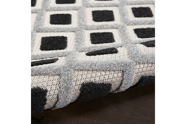Introduce texture and pattern to your porch or deck with ease with this indoor/outdoor rug from the aloha collection. Simple in its sophistication, it features an all-over concentric diamond motif with a simple border in black, white, and gray tones that work beautifully in modern and contemporary settings. Premium, stain resistant fibers offer durability and ease of cleaning (just rinse with a hose and air dry).Serged edges | Premium stain-resistant fibers for durability and easy cleaning | Combination weave | Machine made from easy-care fibers | Power-loomed | Low shedding | Recommended for areas with heavy foot traffic | Indoor/outdoor | Adding a layer of padding helps cushion the rug and diminish pressure, helping to prolong the rug's life; also, the extra padding helps reduce sound in the room | Rug pad recommended | Vacuum regularly, clean spills immediately by blotting with a clean damp sponge or cloth; rinse with a hose if cleaning it outdoors; to extend the life of this area rug, bring it indoors during extreme weather | 100% polypropylene | Imported