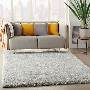 Sink your feet into the deep, dense shag of this Ashland area rug, and you will be seduced by its textural appeal. Its modern fibers are beautifully dyed in soft white and gray tones for a subtle marbleized effect. The cool and contemporary borderless design adds instant chic to any room.Made of polypropylene | Machine made; power loomed | Backed with latex | Moderate shedding | Shag pile | Vacuum regularly; no beater bar | Rug pad recommended | Imported