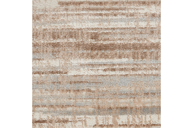 Earthen tones in abstract irregular stripes create an irresistibly chic foundation for your living room, bedroom or home office. Whether your design tastes are minimalistic or a little more rustic glam, this neutral ivory, beige and gray area rug from the Elation Collection is just what you need to bring the disparate elements of your room together.Made of polypropylene and polyester | Machine made; power loomed | Backed with latex | Serged edges | Low shedding | Low pile | Vacuum regularly; no beater bar | Rug pad recommended | Imported