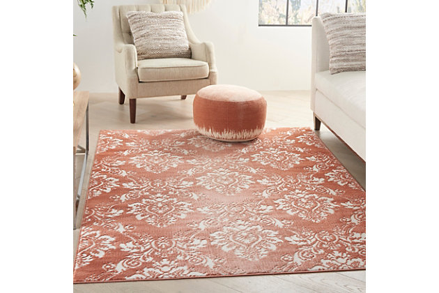 Capture the rustic elegance of a French country cottage with this area rug from the Elation Collection. Sprawling floral damask motifs in ivory on a muted brick red base create a captivating base for French country, farmhouse and boho-chic settings. Subtle abrash effects add to the vintage look of this design.Made of polypropylene and polyester | Machine made; power loomed | Backed with latex | Serged edges | Low shedding | Low pile | Vacuum regularly; no beater bar | Rug pad recommended | Imported