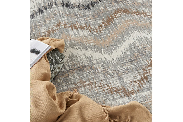 The abstract jagged chevron pattern of this Elation Collection area rug creates a sense of movement in modern and contemporary settings. Cool gray, charcoal, ivory, beige and brown hues add a unique touch to your living room, bedroom or home office.Made of polypropylene and polyester | Machine made; power loomed | Backed with latex | Serged edges | Low shedding | Low pile | Vacuum regularly; no beater bar | Rug pad recommended | Imported