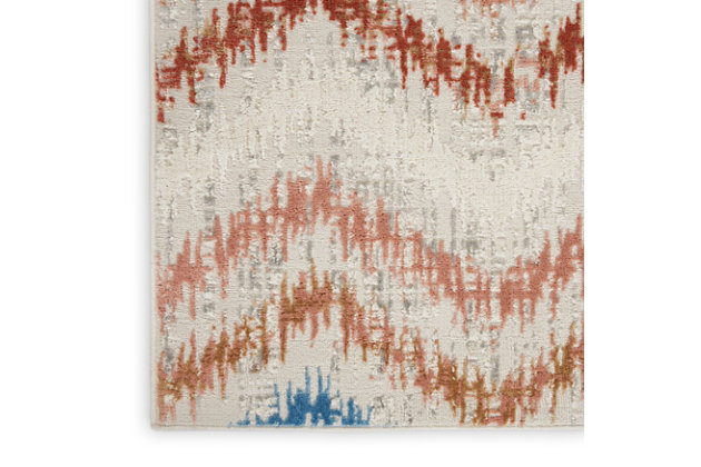 The abstract jagged chevron pattern of this Elation Collection area rug creates a sense of movement in modern and contemporary settings. Cool gray, deep red, ivory, blue and rust orange hues add a unique touch to your living room, bedroom, or home office.Made of polypropylene and polyester | Machine made; power loomed | Backed with latex | Serged edges | Low shedding | Low pile | Vacuum regularly; no beater bar | Rug pad recommended | Imported