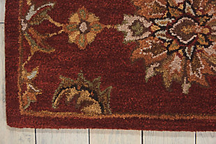 A narrow, linear border gives a new, modern feeling to Persian heritage in this sumptuous rug. Floral motifs and airy ferns dance to the very edge, filling the room with visual interest. A compelling design element for the contemporary home. Made of wool | Handcrafted | Backed with cotton | Moderate shedding  | Tufted | Vacuum regularly; spot clean; professional cleaning recommended  | Rug pad recommended | Imported