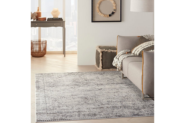 The intrigue of antiquity glimmers in the delicately faded details of this kathy ireland® Home Grand Expressions rug. It’s a sophisticated and urban finishing touch for the contemporary home, in a beautifully balanced palette of soft gray and ivory.Made of polypropylene | Machine made; power loomed | Backed with latex | Distressed finish | Carved details | Medium pile | Low shedding | Vacuum regularly; no beater bar | Rug pad recommended | Imported