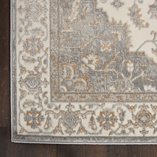 This kathy ireland® Home Grand Villa rug commands attention with a center medallion Persian floral design and stately ornamental border. Soft and sumptuous in lightly contrasting tones of gray, it creates a vintage look with modern appeal. The versatile piece is ideal for decorating the traditional, contemporary or eclectic room.Made of polypropylene and polyester | Machine made; power loomed | Backed with latex | Serged edges | Low pile | Low shedding | Vacuum regularly; no beater bar | Rug pad recommended | Imported