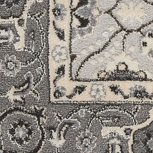 Bring grandeur to your favorite room with this Grand Villa area rug by kathy ireland® Home. Its traditional allover Persian design features botanical motifs and the opulence of an ornate border. The rug merges a vintage look with the modern touch of a tonal, warm gray palette. Made of polypropylene and polyester | Machine made; power loomed | Backed with latex | Serged edges | Low pile | Low shedding | Vacuum regularly; no beater bar | Rug pad recommended | Imported