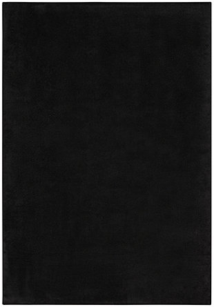 Here’s an indoor-outdoor area rug by Nourison Essentials that has it all. This contemporary, borderless rug in solid, sophisticated black is an ideal choice for gathering places around your home. Designed for active lifestyles, it will withstand heavy traffic without sacrificing comfort. To extend its life, bring it indoors during extreme weather.Made of polypropylene | Machine made; power loomed | Backed with latex | Suitable for indoor/outdoor use  | Low pile | Low shedding | Vacuum regularly; no beater bar | Rug pad recommended | Imported