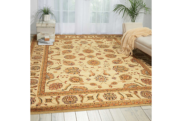 Add an instant touch of European grace and style with this classic Persian-inspired piece. An airy display of palmettes, leaves and floral designs adorn a winding vine pattern, set on a delicious blanched-almond background couched in heartwarming sienna tones. This rug features a truly eye-catching design that will invigorate any decor.Made of polypropylene | Machine made; power loomed | Backed with latex | Serged edges | Cut pile | Low shedding | Vacuum regularly; spot clean; professional cleaning recommended | Rug pad recommended | Imported