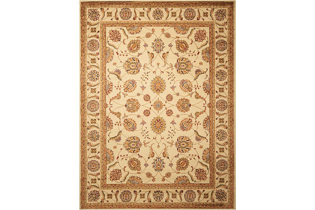 Add an instant touch of European grace and style with this classic Persian-inspired piece. An airy display of palmettes, leaves and floral designs adorn a winding vine pattern, set on a delicious blanched-almond background couched in heartwarming sienna tones. This rug features a truly eye-catching design that will invigorate any decor.Made of polypropylene | Machine made; power loomed | Backed with latex | Serged edges | Cut pile | Low shedding | Vacuum regularly; spot clean; professional cleaning recommended | Rug pad recommended | Imported