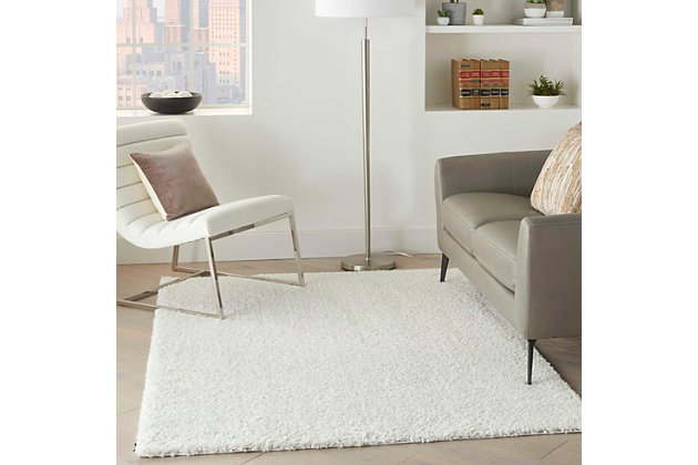 Bask in easy comfort with a totally modern shag area rug that’s got just the right depth for plush, inviting texture. Part of the Shangri-La Collection, it has everything you want in a fashionable shag area rug: delightful texture, a simple edge and borderless design. It's the perfect finishing touch for your casual lifestyle.Made of polypropylene | Machine made; power loomed | Backed with jute | Serged edges | Shag pile | Low shedding | Rug pad recommended | Vacuum regularly; no beater bar | Imported