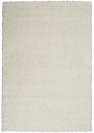 Bask in easy comfort with a totally modern shag area rug that’s got just the right depth for plush, inviting texture. Part of the Shangri-La Collection, it has everything you want in a fashionable shag area rug: delightful texture, a simple edge and borderless design. It's the perfect finishing touch for your casual lifestyle.Made of polypropylene | Machine made; power loomed | Backed with jute | Serged edges | Shag pile | Low shedding | Rug pad recommended | Vacuum regularly; no beater bar | Imported