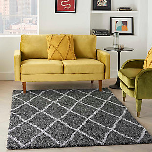 Luxury meets subtlety in this thick, contemporary shag area rug from the Shangri-La Collection. Its modern approach to shag gives you a rich, plush texture that is totally irresistible. This rug is rich and inviting in an open lattice pattern of light gray on deep charcoal.Made of polypropylene | Machine made; power loomed | Backed with jute | Serged edges | Shag pile | Low shedding | Rug pad recommended | Vacuum regularly; no beater bar | Imported