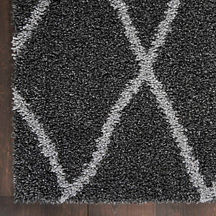 Luxury meets subtlety in this thick, contemporary shag area rug from the Shangri-La Collection. Its modern approach to shag gives you a rich, plush texture that is totally irresistible. This rug is rich and inviting in an open lattice pattern of light gray on deep charcoal.Made of polypropylene | Machine made; power loomed | Backed with jute | Serged edges | Shag pile | Low shedding | Rug pad recommended | Vacuum regularly; no beater bar | Imported