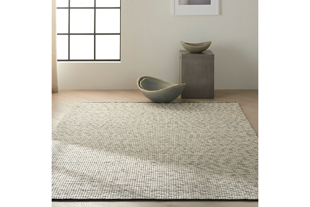 In mineral tones of quartz and white, this hand woven natural Calvin Klein Lowland wool area rug merges understated color with striking design and a stunning surface texture to offer a modern, minimalist layer of laidback luxury to any interior.43% Wool, 29% Cotton, 14% Polyester, 7% Rayon, 7% Nylon | Imported | Handcrafted | Flat weave | Handmade | Tufted | Moderate shedding | Recommended for areas with heavy foot traffic | Rectangle | Indoor only