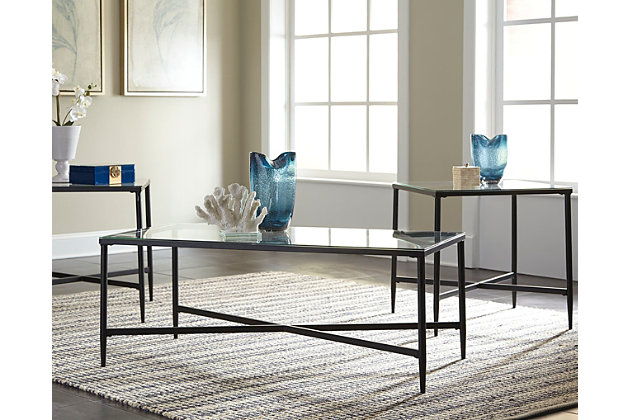 This metal and glass coffee table set serves up a less-is-more look sure to satisfy your sophisticated taste. Cross-bar stretcher design is simply striking. Clear glass tabletops serve an open-and-airy aesthetic.Includes 1 coffee table and 2 end tables | Made of metal and glass | Assembly required | Estimated Assembly Time: 45 Minutes