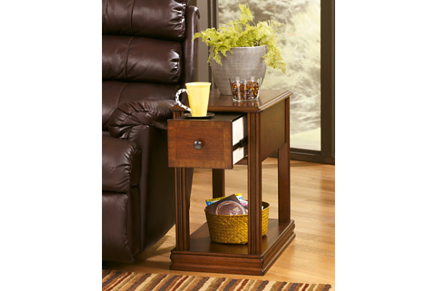 Inlay accents, fluted details and an oil-rubbed effect on the rich finish give the Breegin chairside end table such great character. The base shelf is just the place for a storage basket, decorative vase or other accent piece. You’ll love the deep drawer with removable tray offering handy storage, too.Hand-finished | 1 fixed shelf | Made of veneers, wood and engineered wood | Assembly required | Pewter-tone hardware | 1 drawer with removable black PVC laminate tray | Excluded from promotional discounts and coupons | Estimated Assembly Time: 15 Minutes