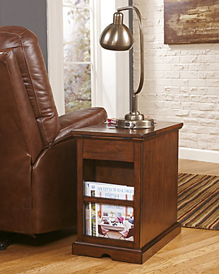 So much form and function in a beautifully compact piece of furniture. The richly styled Laflorn chairside end table puts it all within reach, including a flip-up top panel revealing a power port—perfect for keeping your phone or laptop charged. Hidden twin cup holders and interior shelved storage are also a welcome surprise.Hand-finished | Made of veneers, wood and engineered wood | Assembly required | 1 cabinet with 1 adjustable shelf | Pull-out tray with 2 recessed cup holders and remote control slot | Flip-top compartment with 3 electrical outlets, 2 USB slots | Power Cord, UL listed | Aged bronze-tone hardware | Excluded from promotional discounts and coupons