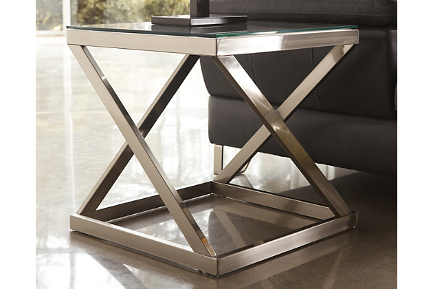 Your quest for the ultimate end table has come to an end—that is if you lean toward contemporary. Sporting an angled metal base that’s striking from every angle, the Coylin square end table is topped off with clear glass with polished edging for a completely modern look.Made of metal and glass | Beveled glass tabletop | Assembly required | Brushed nickel-tone metal | Estimated Assembly Time: 30 Minutes
