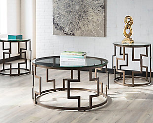 Frostline coffee table set takes a cool twist on contemporary style. Drum form metal bases sport a graphic keyway design that’s so striking. Clear glass tabletops naturally enhance the open and airy mood.1 coffee table and 2 end tables | Made of tubular metal and clear tempered glass | Bronze-tone base finish | Assembly required | Clean with a soft, dry cloth | Estimated Assembly Time: 45 Minutes