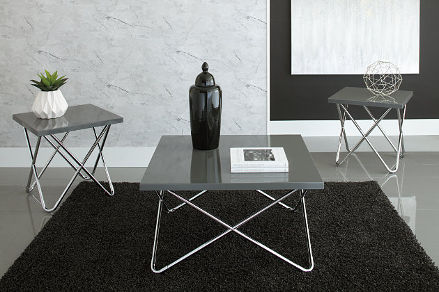 Introduce a sleek look in your living area with the Dashard occasional table set. The attractively smooth glossy gray tops of the coffee table and two end tables are supported by four uniquely designed tubular metal legs in a bright chrome finish. They overlap, much like that of angular paperclips to provide a crisp, clean design that everyone will admire. This set easily fits right in with other contemporary decor.Includes rectangular coffee table and 2 square end tables | Frames made of tubular metal with chrome finish | Tops made of thick sheet metal with a gray powdercoat finish | Assembly required