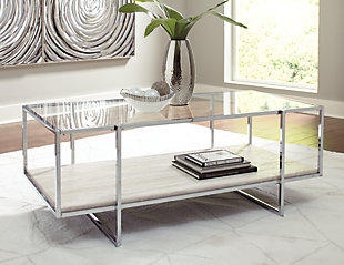 Contemporary style gets a modern attitude in the Bodalli cocktail table. A tempered glass top showcases the replicated travertine stone shelf. The box design of the metal frame creates open space to offer the illusion of more room.Made of engineered wood and decorative laminate | Tempered glass top | Chrome-tone metal frame | Faux travertine marble shelf | Assembly required | Estimated Assembly Time: 30 Minutes