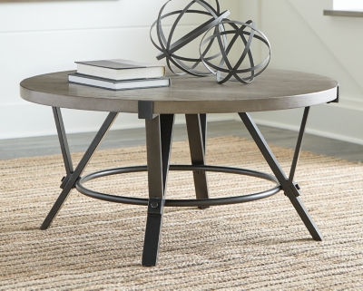 Raise the mood and build upon your good taste with the Zontini coffee table in your room. The table top with a light pickled finish over white oak veneer pairs with metal frames for a warm, urban industrial feel. Place this piece in the front of your sofa and enjoy the structure it brings to your home decor.Top made of white oak veneer and engineered wood | Top with light brown finish | Metal base in raw steel-tone finish | Assembly required | Estimated Assembly Time: 15 Minutes