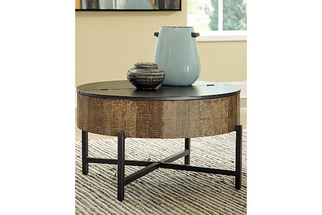 Blending a primitive drum design and warm, multi-tonal finishes, there's more to this boho-chic coffee table than meets the eye—hidden storage under the lid keeps everything out of sight yet close at hand.Made of mango wood, engineered wood and metal | Multi-color wood tone with white wax accents | Gunmetal finish on metal frame and engineered wood lid | Convenient drum design with hidden storage under lid | Assembly required | Estimated Assembly Time: 15 Minutes